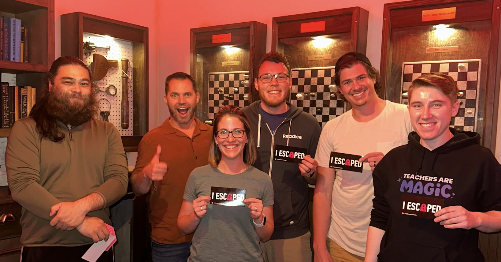 The MagicSchool engineering team posing with "I Escaped" stickers after successfully completing an escape room